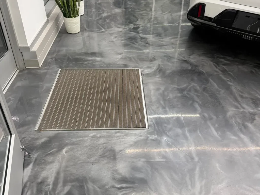Showroom floor cleaning at a car dealership